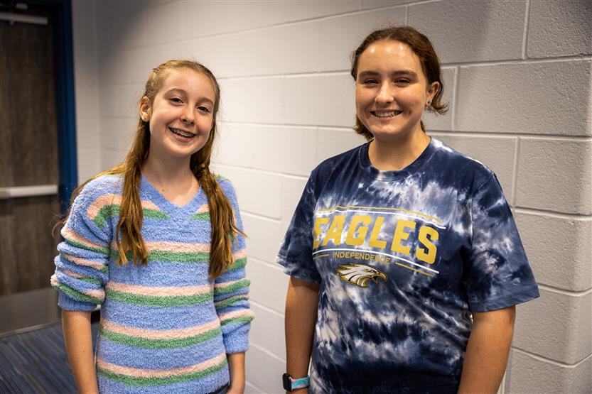 Two girls smile